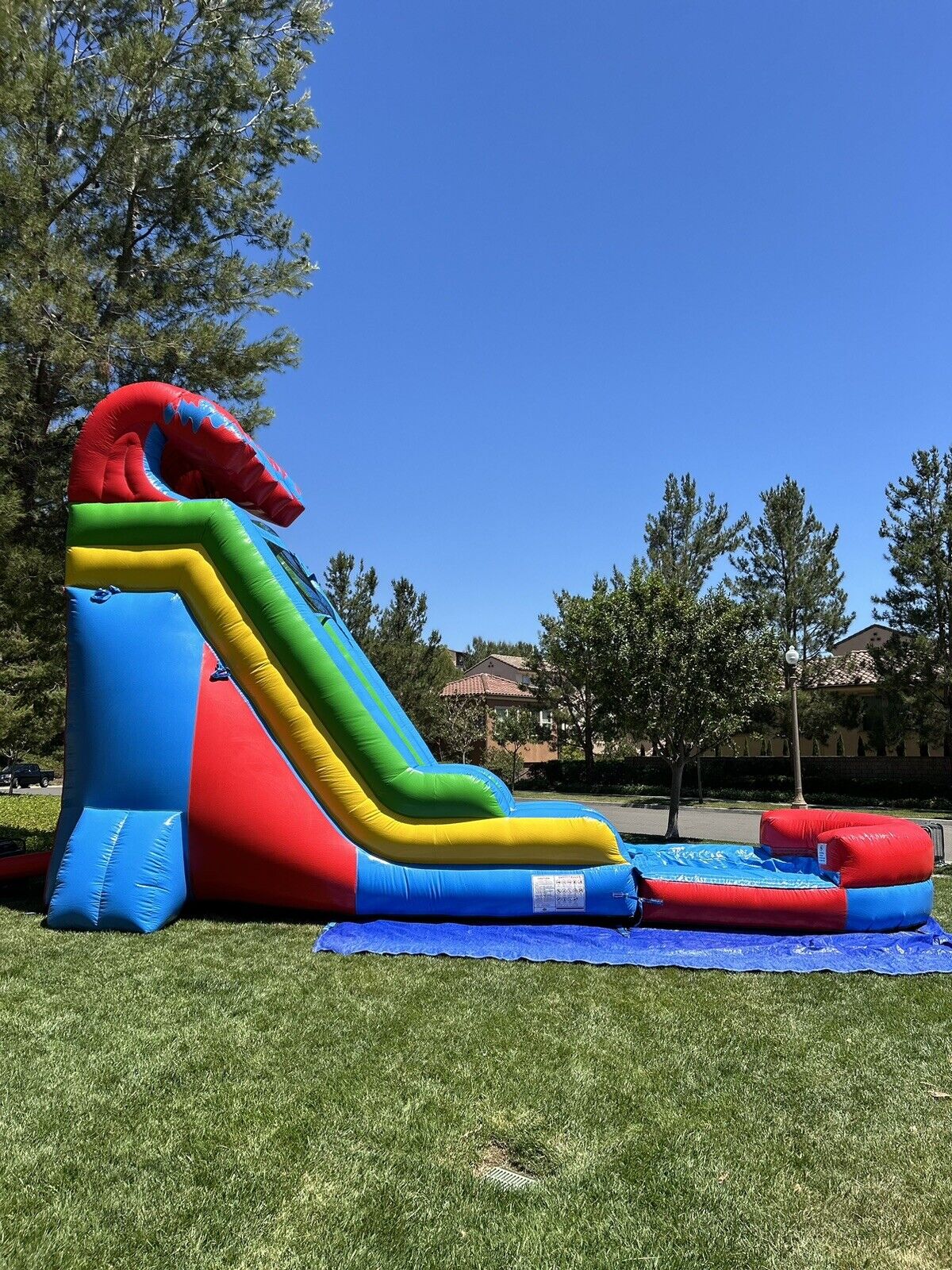 18ft COMMERCIAL GRADE FIESTA INFLATABLE WATERSLIDE 1.5hp,POOL & BUMPER INCLUDED.