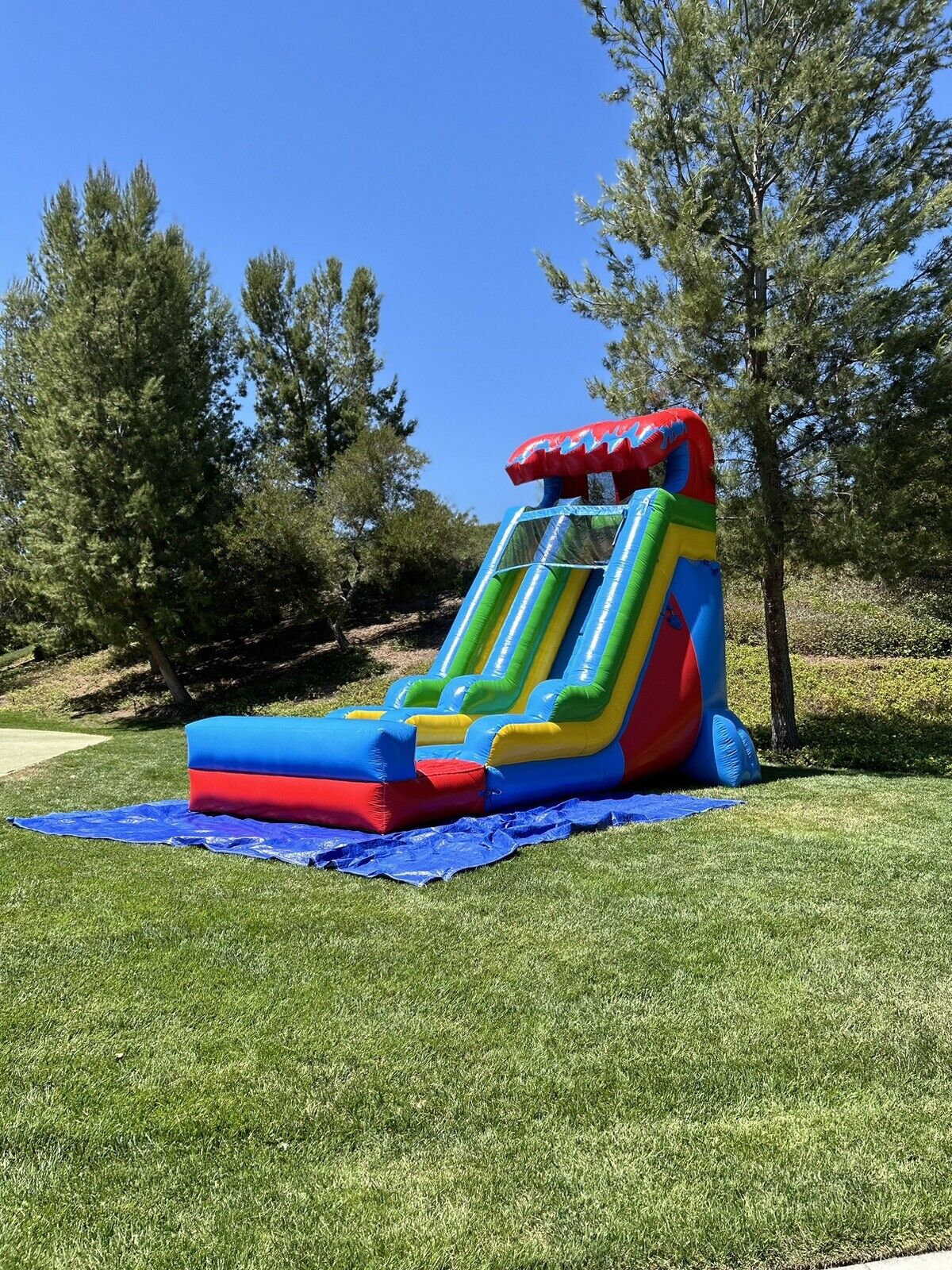 18ft COMMERCIAL GRADE FIESTA INFLATABLE WATERSLIDE 1.5hp,POOL & BUMPER INCLUDED.