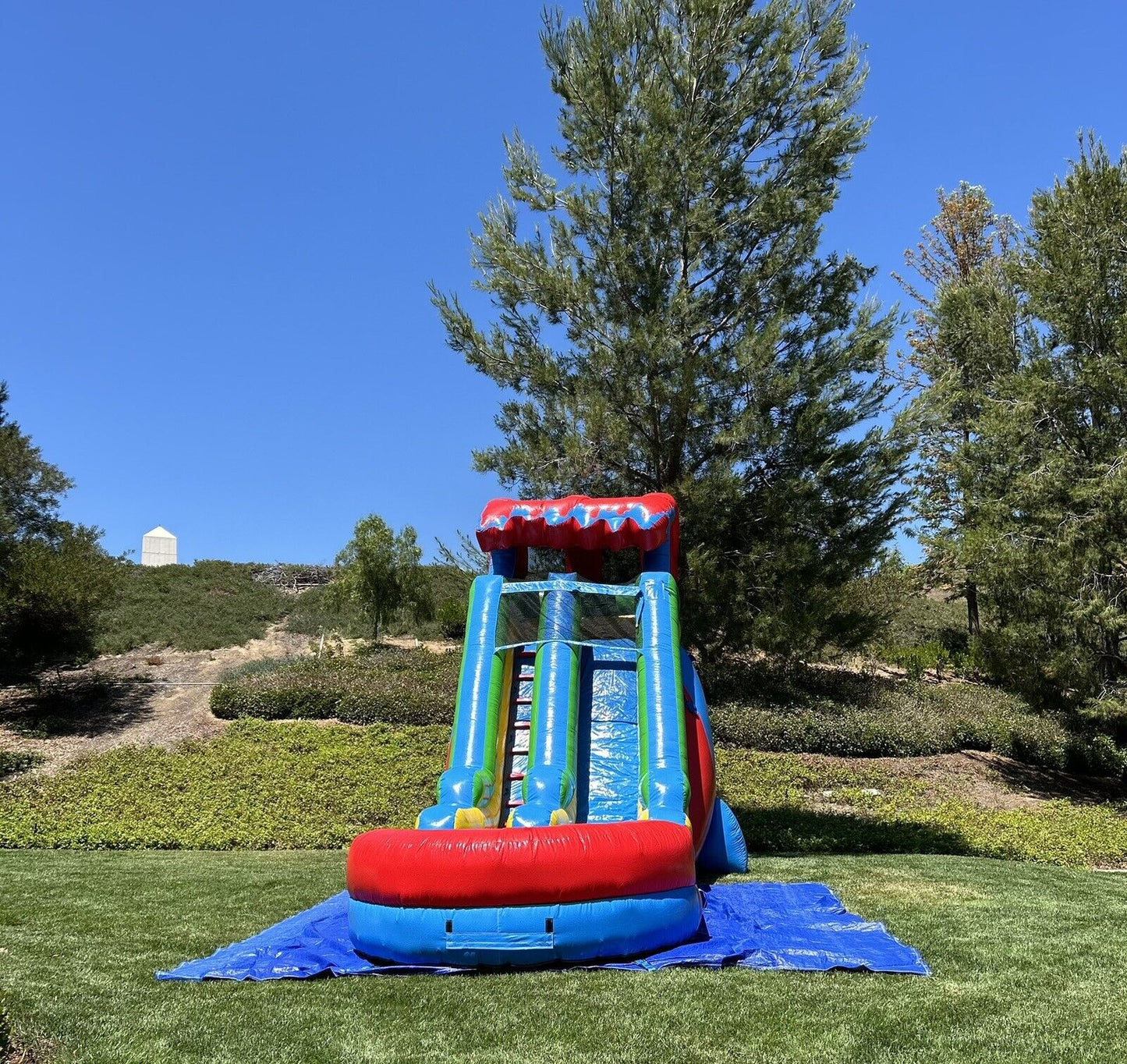 18ft COMMERCIAL GRADE FIESTA INFLATABLE WATERSLIDE 1.5hp,POOL & BUMPER INCLUDED.