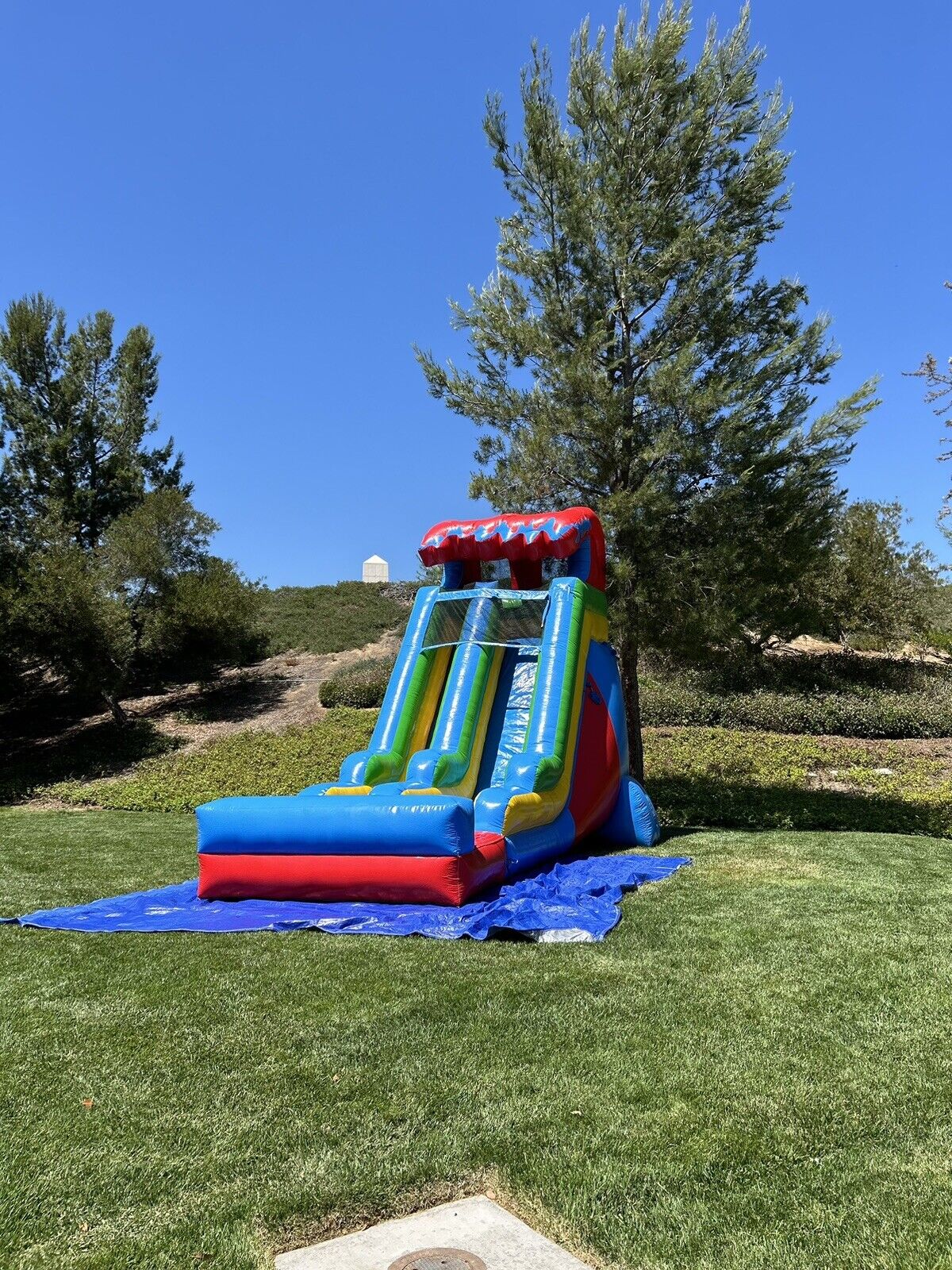 18ft COMMERCIAL GRADE FIESTA INFLATABLE WATERSLIDE 1.5hp,POOL & BUMPER INCLUDED.