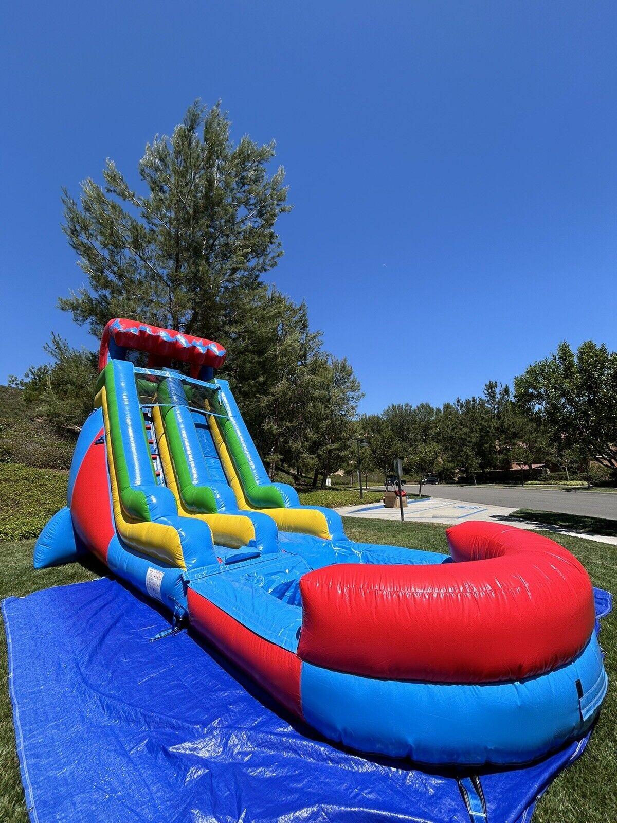 18ft COMMERCIAL GRADE FIESTA INFLATABLE WATERSLIDE 1.5hp,POOL & BUMPER INCLUDED.