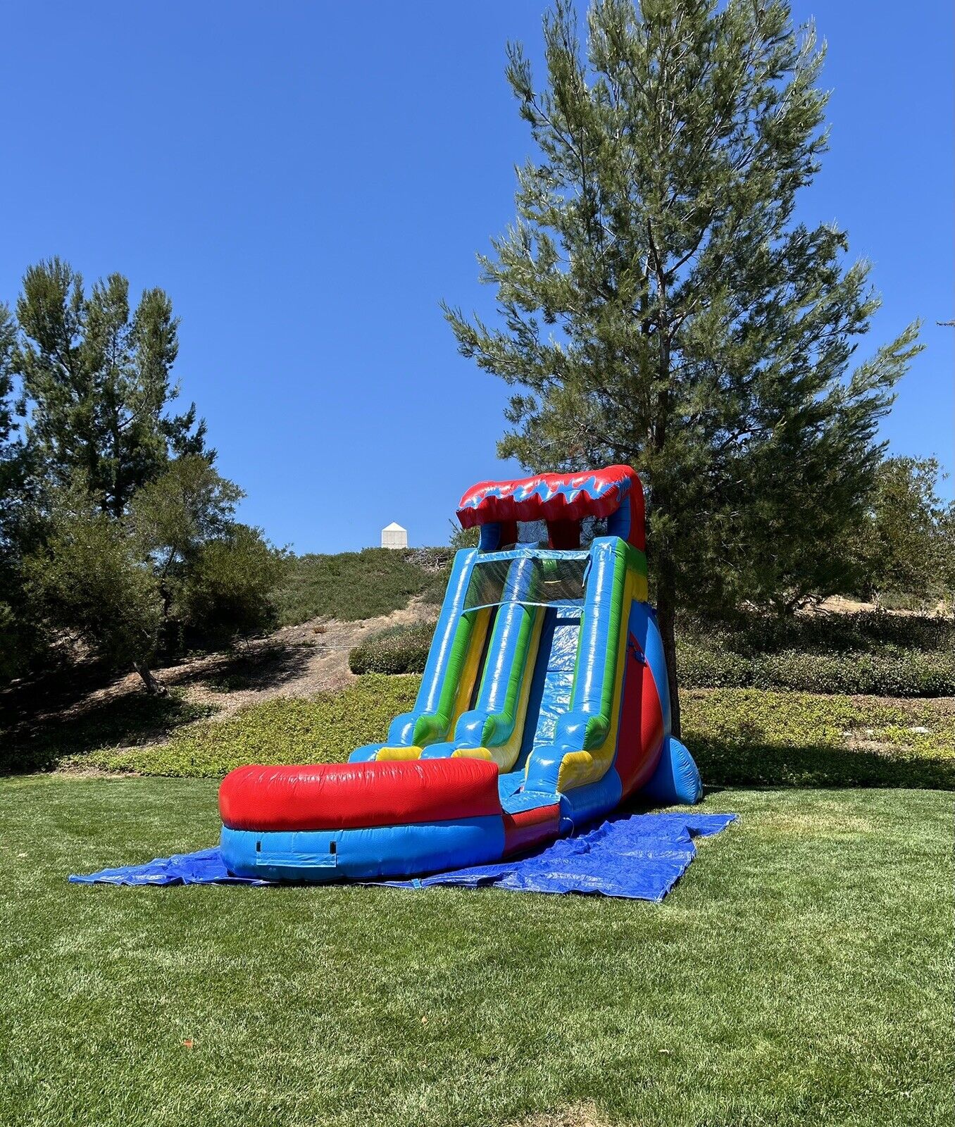 18ft COMMERCIAL GRADE FIESTA INFLATABLE WATERSLIDE 1.5hp,POOL & BUMPER INCLUDED.