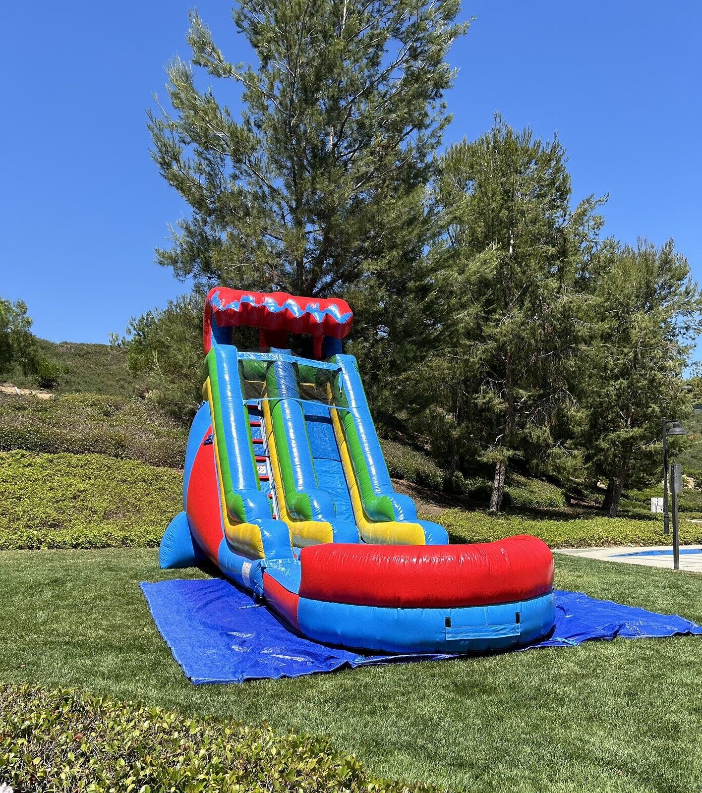 18ft COMMERCIAL GRADE FIESTA INFLATABLE WATERSLIDE 1.5hp,POOL & BUMPER INCLUDED.